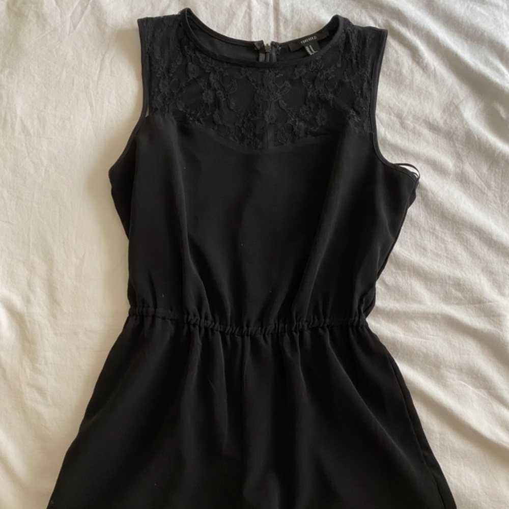 Black romper with an upper lace panel